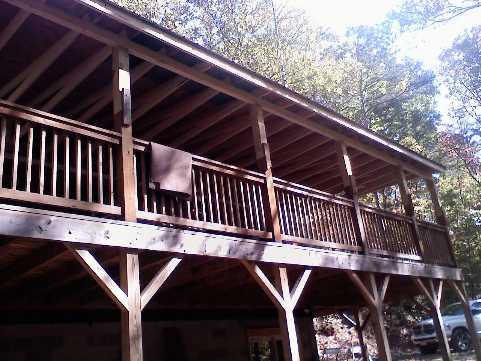 Timber framing under a new elevated porch and deck — Roof Leak Repair in Michigantown by Roofing Brothers